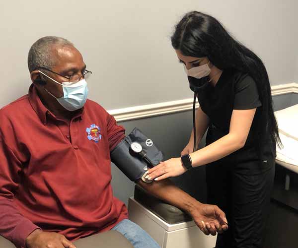 patient getting pulse read by nurse in Rochester, NY | Northern Star Medical<br />
